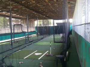 The Cages at Frank Permuy Park are covered so that the players can practice in the